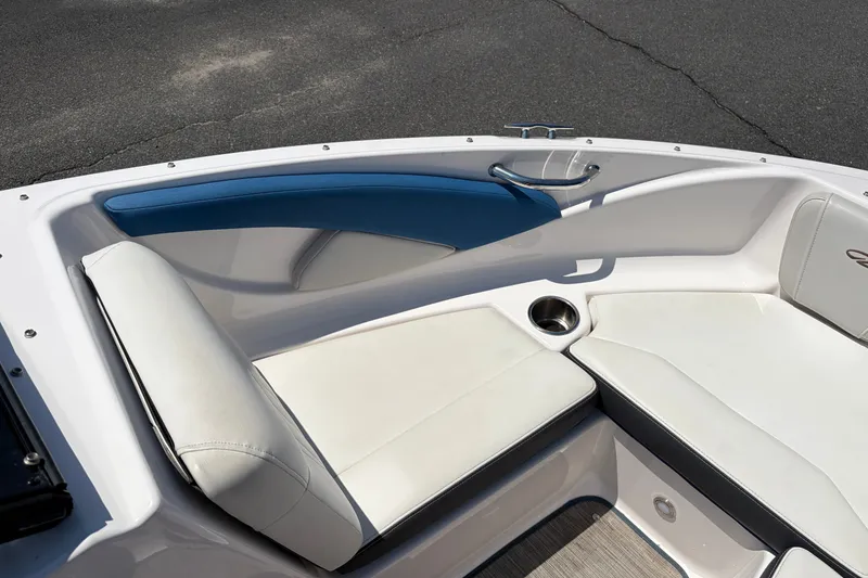 Slide: The Image of 2016 Regal 1900 ESX Bowrider interior with white seating and blue accents. - 10