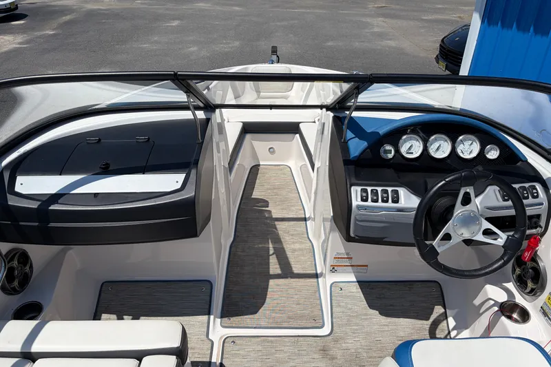 Slide: The Image of 2016 Regal 1900 ESX Bowrider interior with steering wheel and dashboard controls. - 12