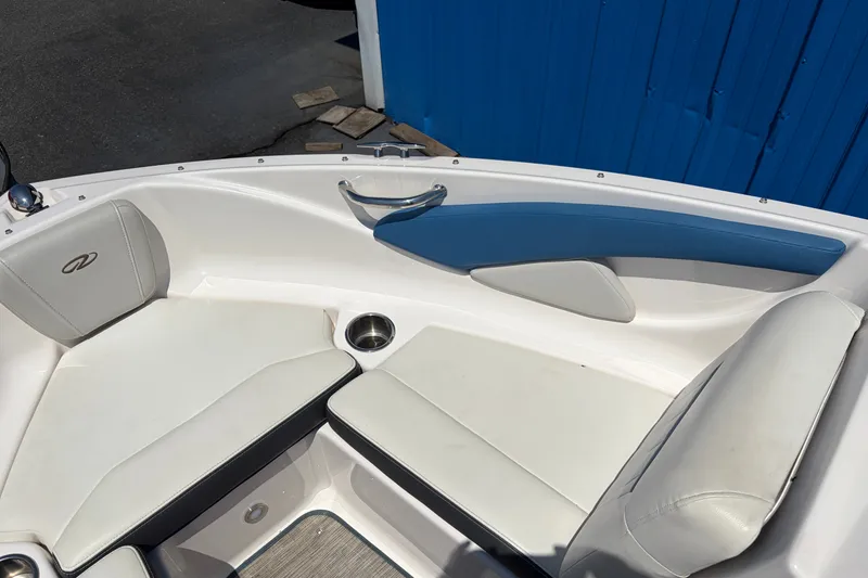 Slide: The Image of 2016 Regal 1900 ESX Bowrider interior with white and blue seating, cup holder, and sleek design. - 11