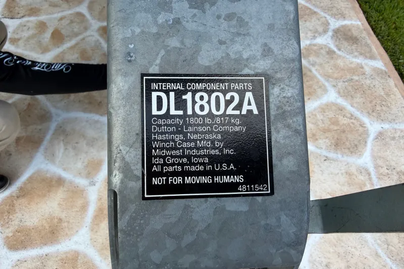 Slide: The Image of Label on a winch with technical details and a warning notice. - 43