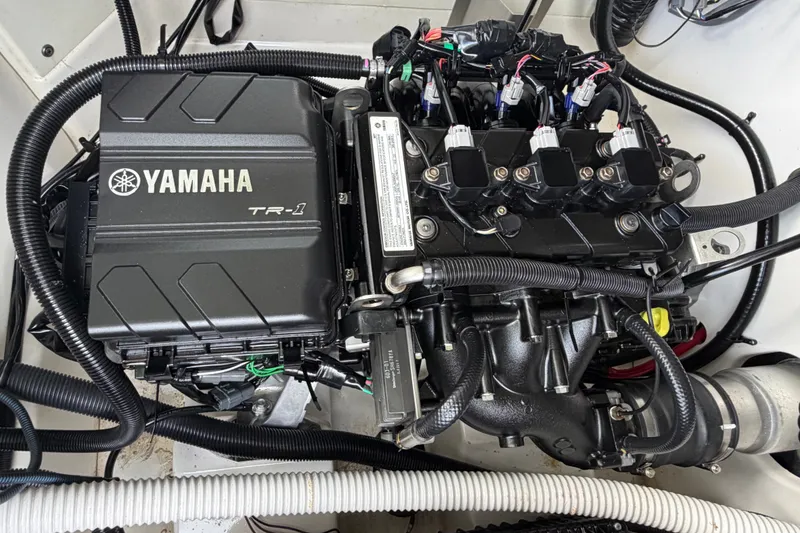 Slide: The Image of 2022 Yamaha AR210 engine compartment showcasing TR-1 engine components and wiring. - 36