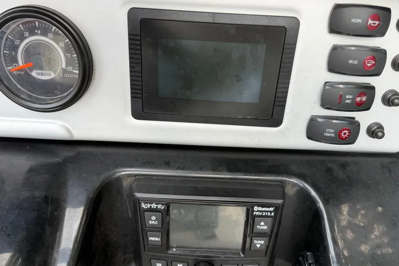 Slide: The Image of Dashboard of a 2022 Yamaha AR210 boat with controls and display. - 20