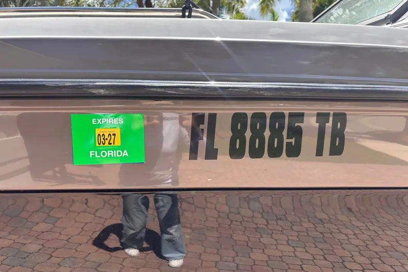 Slide: The Image of 2022 Yamaha AR210 boat with Florida registration FL 8885 TB, expiring March 2027. - 53