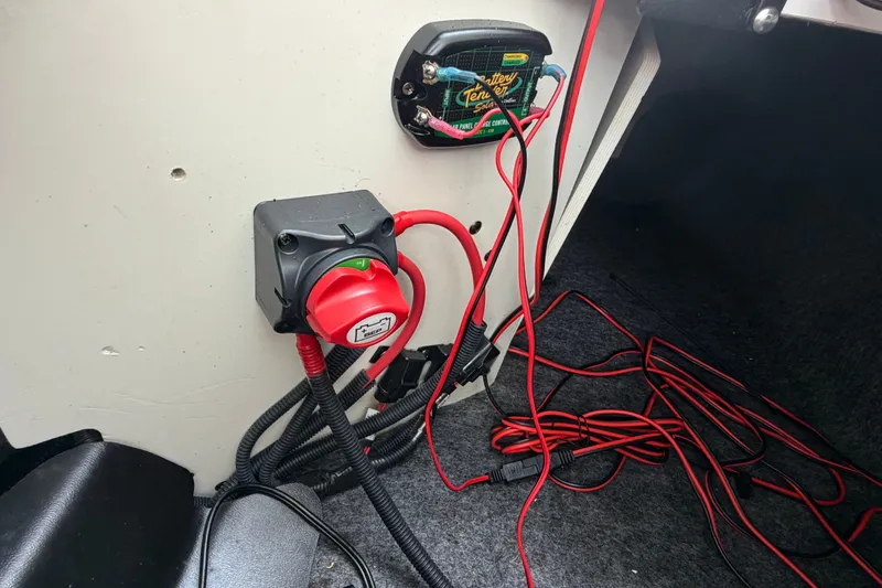 Slide: The Image of 2022 Yamaha AR210 boat wiring setup with battery switch and cables. - 14