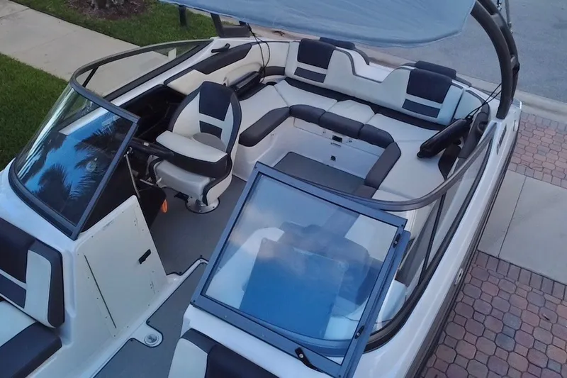 Slide: The Image of 2022 Yamaha Boats AR210 interior with sleek seating and modern design. - 16