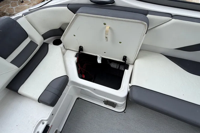 Slide: The Image of Open storage compartment in 2022 Yamaha AR210 boat interior. - 15