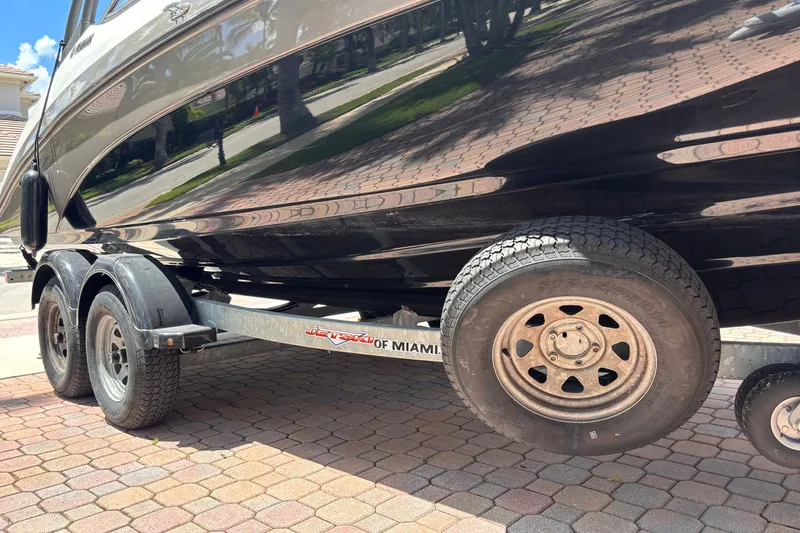 Slide: The Image of 2022 Yamaha Boats AR210 on trailer, parked on brick driveway. - 49