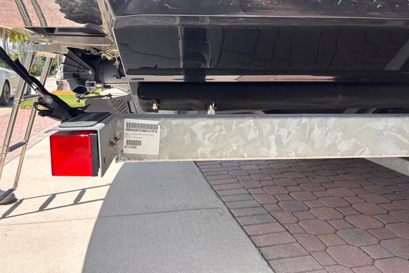 Slide: The Image of Rear view of a 2022 Yamaha Boats AR210 on a trailer, showing hull and trailer details. - 44