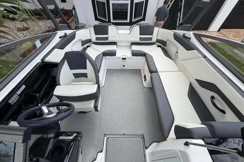 Slide: The Image of 2022 Yamaha Boats AR210 interior with sleek seating and modern design. - 9