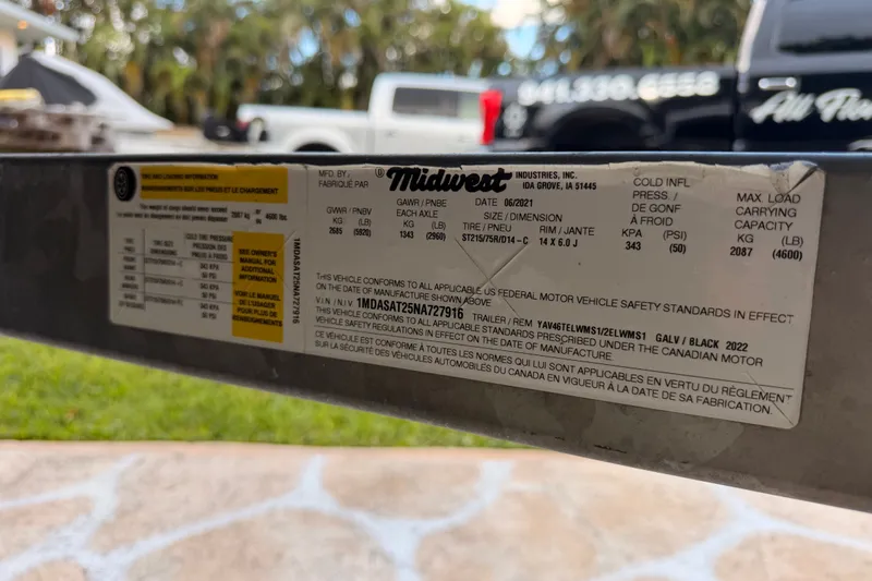 Slide: The Image of Label on a Midwest Industries trailer, detailing specifications and compliance information. - 41