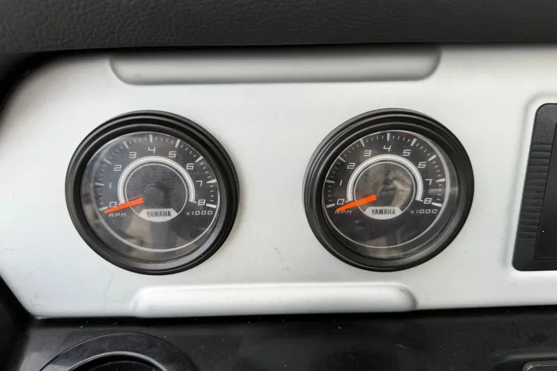 Slide: The Image of Dashboard gauges of a 2022 Yamaha Boats AR210, displaying RPM readings. - 22
