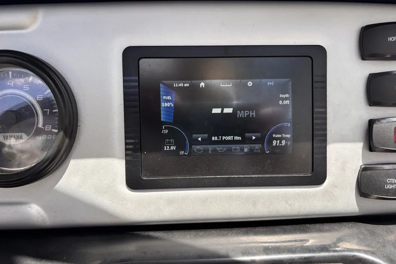 Slide: The Image of Dashboard of 2022 Yamaha AR210 boat showing speed, fuel, and water temperature. - 33