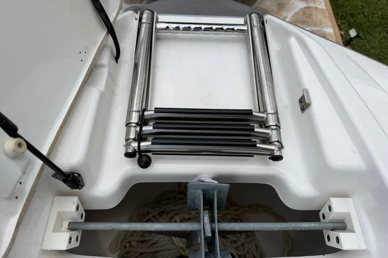 Slide: The Image of 2022 Yamaha AR210 boat ladder and anchor storage compartment. - 34