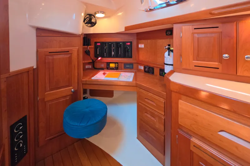 Slide: The Image of Cozy wooden interior of a 2008 Tartan 4300 yacht with navigation station. - 42