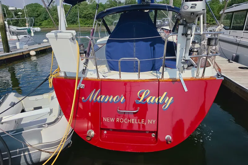 Slide: The Image of Red Tartan 4300 sailboat named "Manor Lady" docked in New Rochelle, NY, 2008 model. - 2