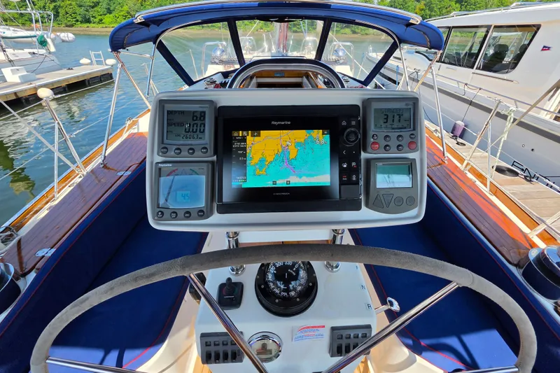 Slide: The Image of Cockpit of 2008 Tartan 4300 sailboat with navigation instruments and steering wheel. - 8