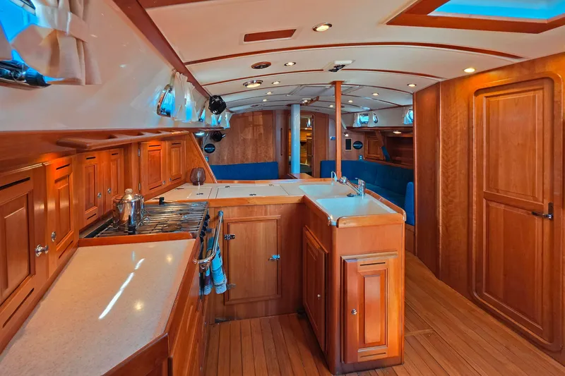 Slide: The Image of Luxurious 2008 Tartan 4300 yacht interior with wooden cabinetry and modern amenities. - 32
