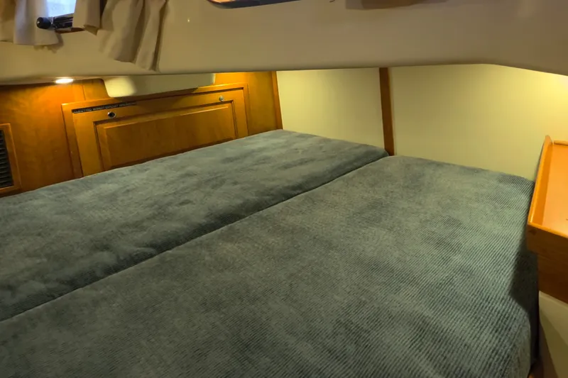 Slide: The Image of Cozy cabin interior of 2008 Tartan 4300 yacht with twin beds and wooden accents. - 39