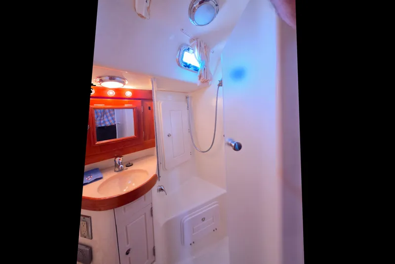 Slide: The Image of Compact bathroom in a 2008 Tartan 4300 yacht with shower and vanity. - 37
