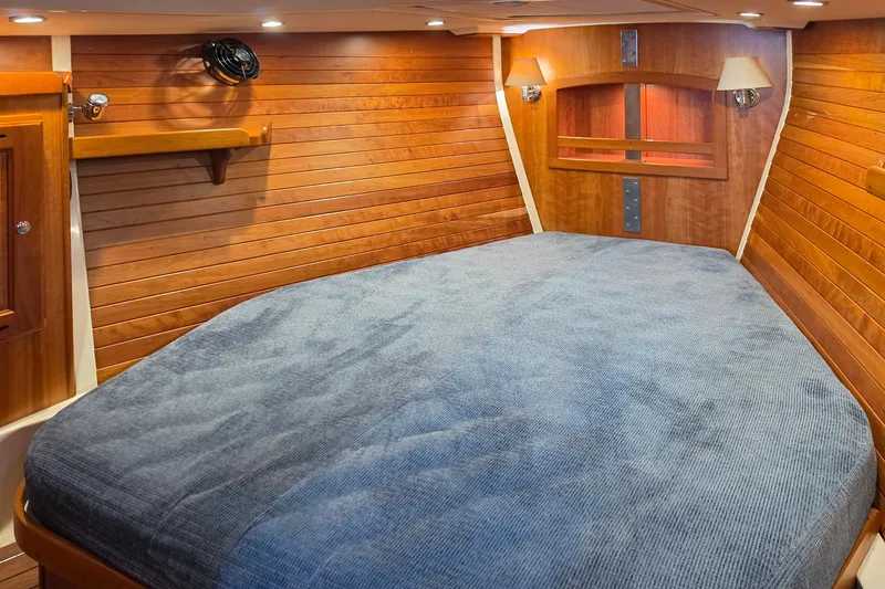 Slide: The Image of Luxurious wooden cabin interior of 2008 Tartan 4300 yacht with cozy bed. - 35