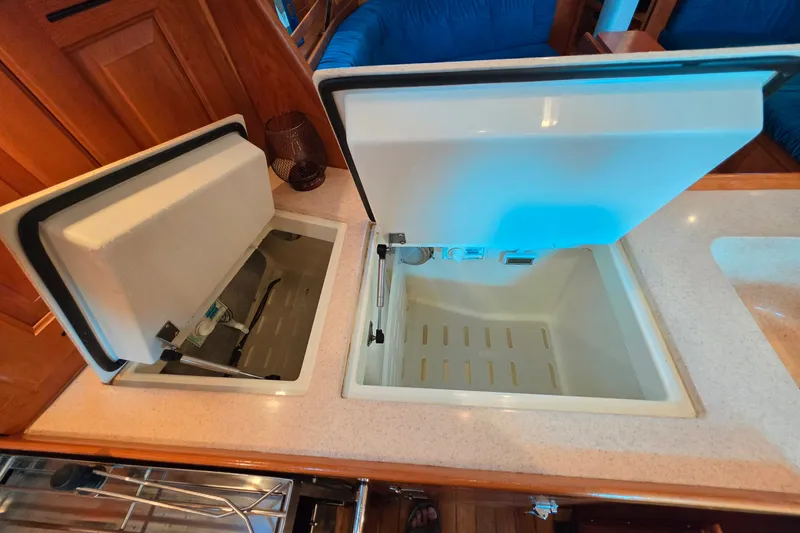 Slide: The Image of Open storage compartments on a 2008 Tartan 4300 yacht interior. - 31