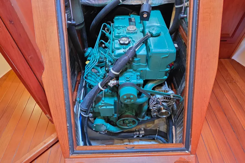 Slide: The Image of Engine compartment of a 2008 Tartan 4300 sailboat, showcasing a well-maintained marine engine. - 46