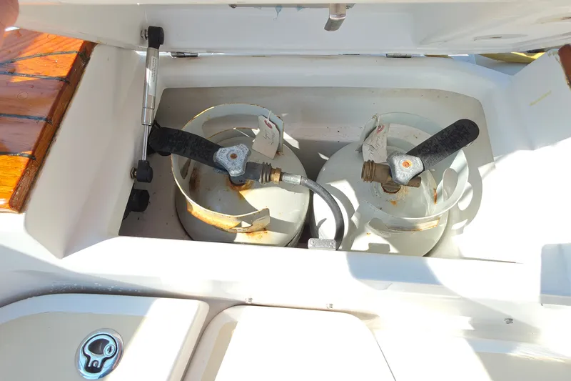 Slide: The Image of Propane tanks in a 2008 Tartan 4300 yacht storage compartment. - 13