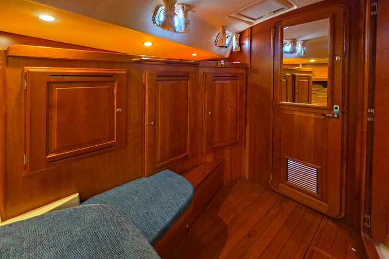 Slide: The Image of Luxurious wooden interior of 2008 Tartan 4300 yacht cabin with cozy seating. - 33