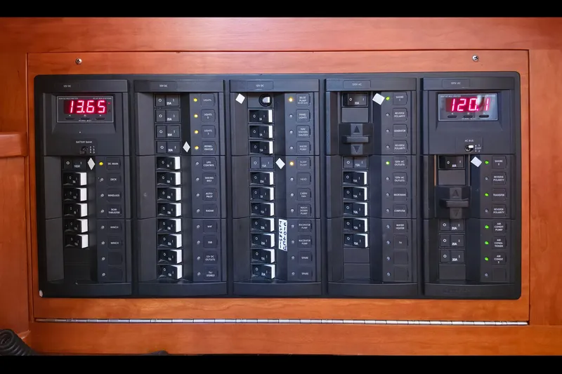 Slide: The Image of Electrical panel on a 2008 Tartan 4300 yacht, displaying voltage readings and circuit breakers. - 45