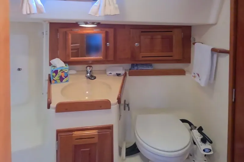 Slide: The Image of Bathroom interior of 2008 Tartan 4300 yacht with wooden cabinets and modern fixtures. - 40