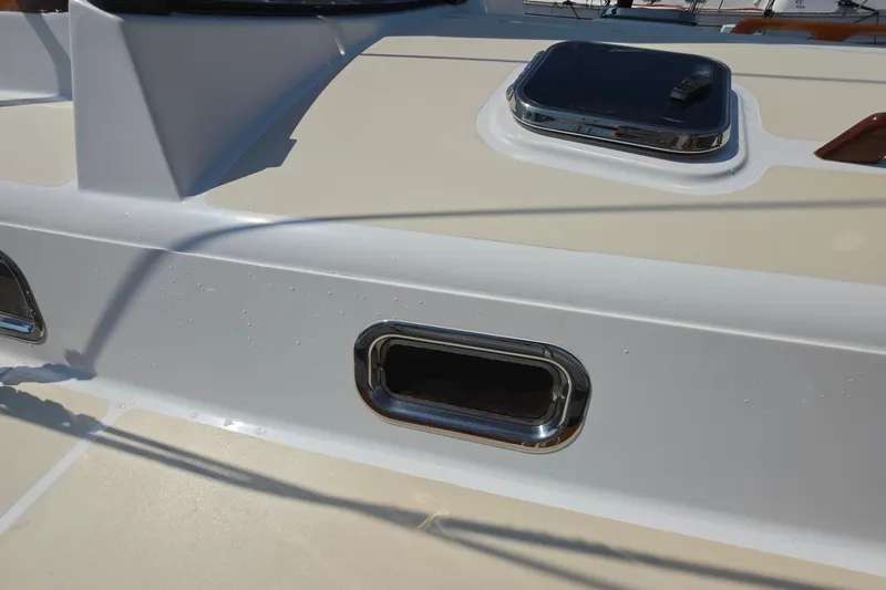 Slide: The Image of Close-up of a 2008 Tartan 4300 yacht deck with hatch and porthole. - 17