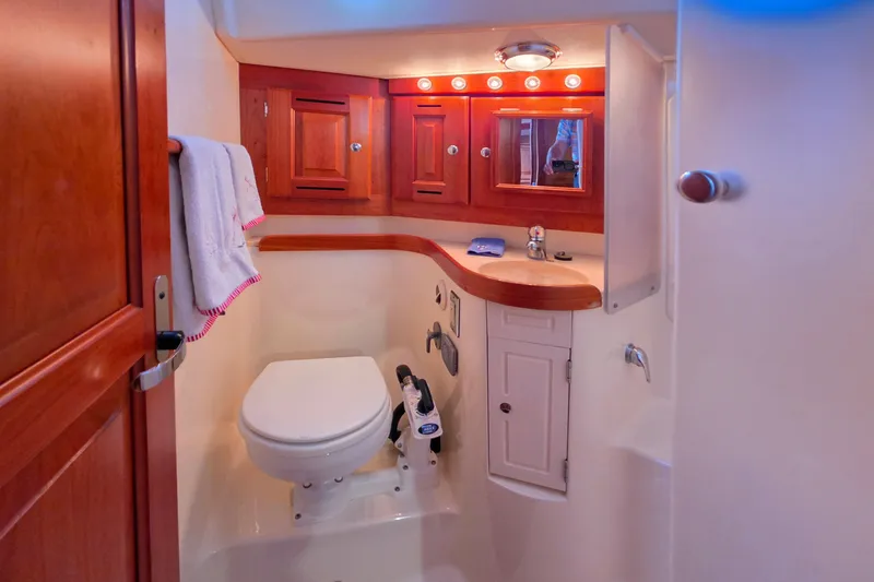 Slide: The Image of Luxurious 2008 Tartan 4300 yacht bathroom with wooden cabinetry and modern fixtures. - 36
