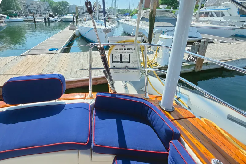 Slide: The Image of Cockpit of 2008 Tartan 4300 yacht with blue cushions, docked at marina. - 11
