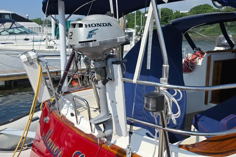 Slide: The Image of Tartan 4300 sailboat with Honda outboard motor, docked at marina, 2008 model. - 14