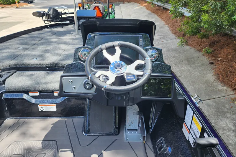 Slide: The Image of 2027 Nitro Z21 XL Pro boat cockpit with steering wheel and control panel. - 6