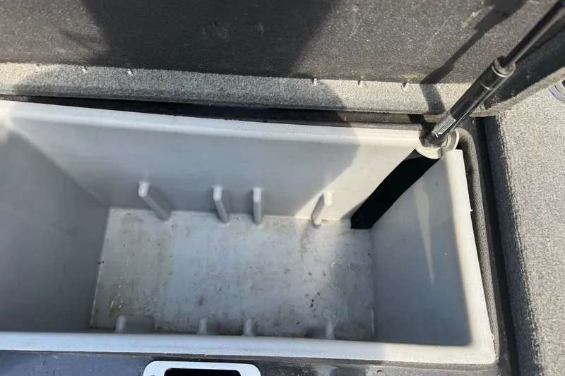 Slide: The Image of Open storage compartment in a 2003 Gambler 2100 boat. - 18
