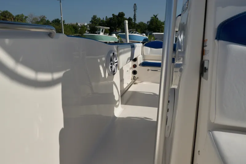 Slide: The Image of 2016 Robalo R200 Center Console boat interior with blue seating and white deck. - 18