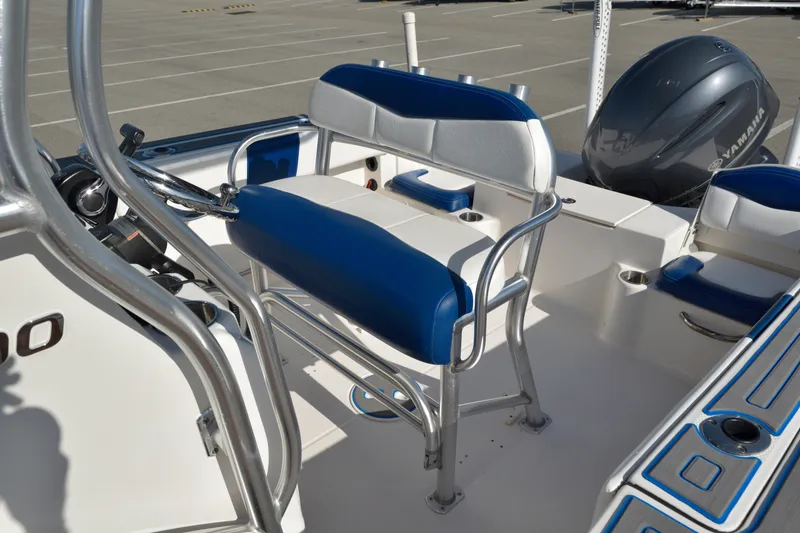 Slide: The Image of 2016 Robalo R200 Center Console boat interior with blue and white seating and Yamaha engine. - 15