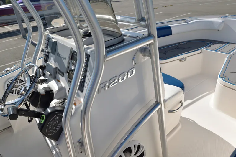 Slide: The Image of 2016 Robalo R200 Center Console boat interior with steering wheel and seating. - 17