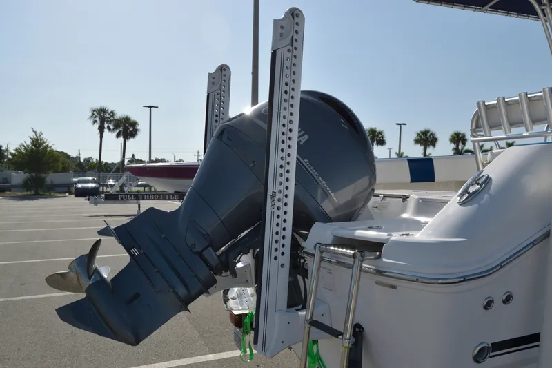 Slide: The Image of 2016 Robalo R200 Center Console boat with Yamaha outboard motor in parking lot. - 5