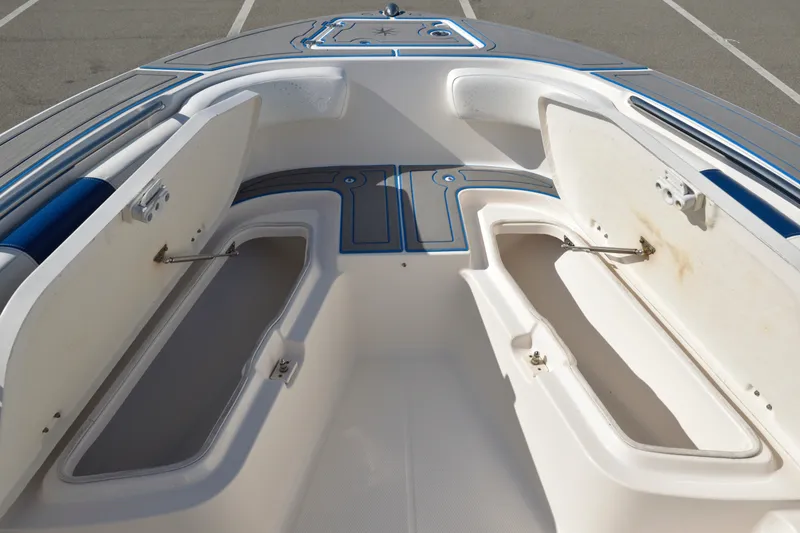 Slide: The Image of 2016 Robalo R200 Center Console boat with open storage compartments. - 24