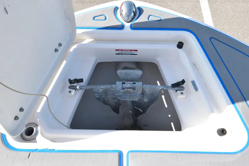 Slide: The Image of Anchor storage compartment on a 2016 Robalo R200 Center Console boat. - 26
