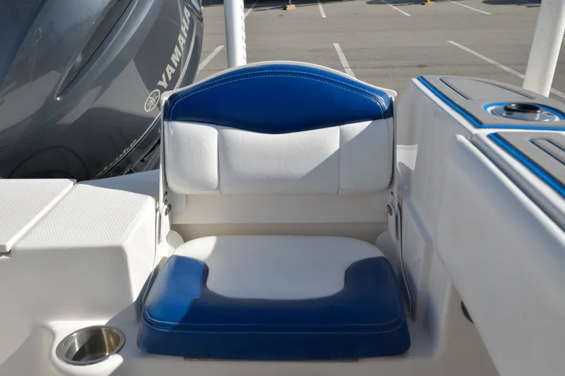 Slide: The Image of 2016 Robalo R200 Center Console boat seat with blue and white upholstery. - 12