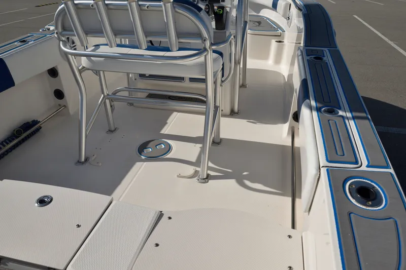 Slide: The Image of 2016 Robalo R200 Center Console boat interior with seating and rod holders. - 9