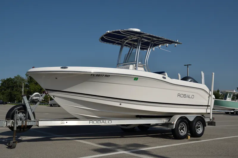 The Image of 2016 Robalo R200 Center Console boat on trailer in parking lot. - 0