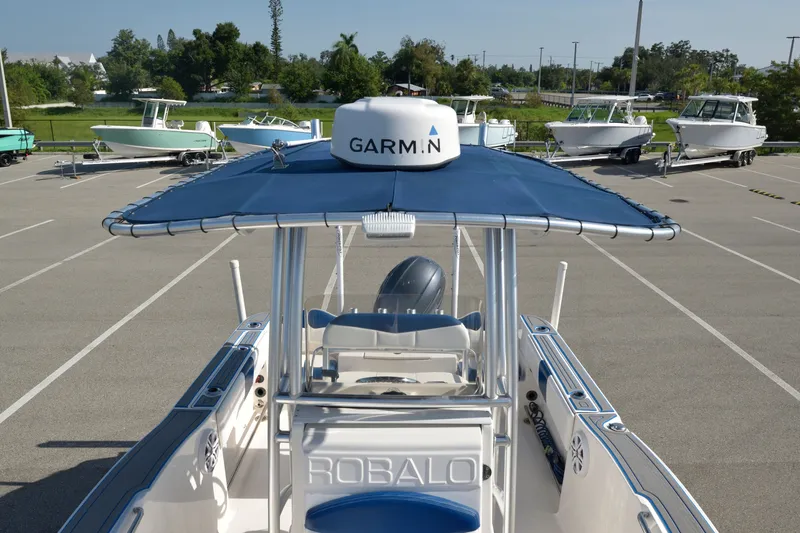 Slide: The Image of 2016 Robalo R200 Center Console boat with Garmin equipment in a parking lot. - 21