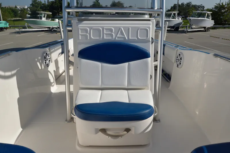 Slide: The Image of 2016 Robalo R200 Center Console boat interior with blue and white seating. - 20