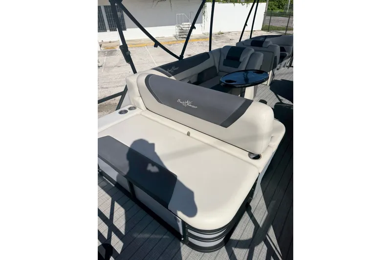 Slide: The Image of 2023 SunChaser Geneva Sport 23 SB boat interior with comfortable seating and table. - 14