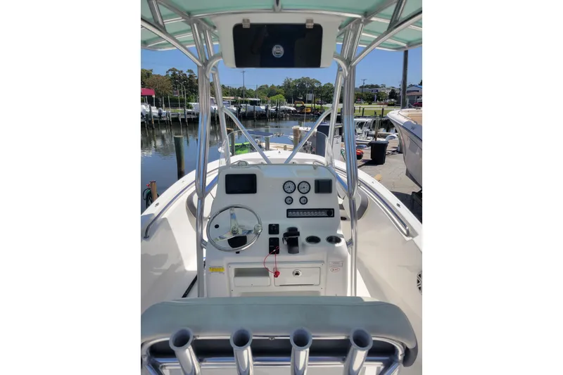 Slide: The Image of 2020 Tidewater 198 CC Adventure boat dashboard with steering wheel and gauges. - 2