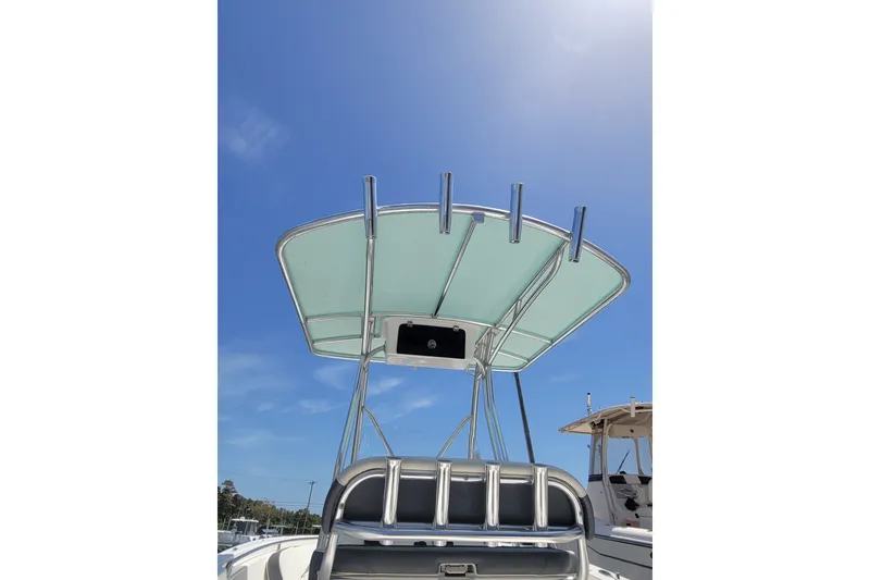 Slide: The Image of Tidewater 198 CC Adventure 2020 boat with T-top under clear blue sky. - 8